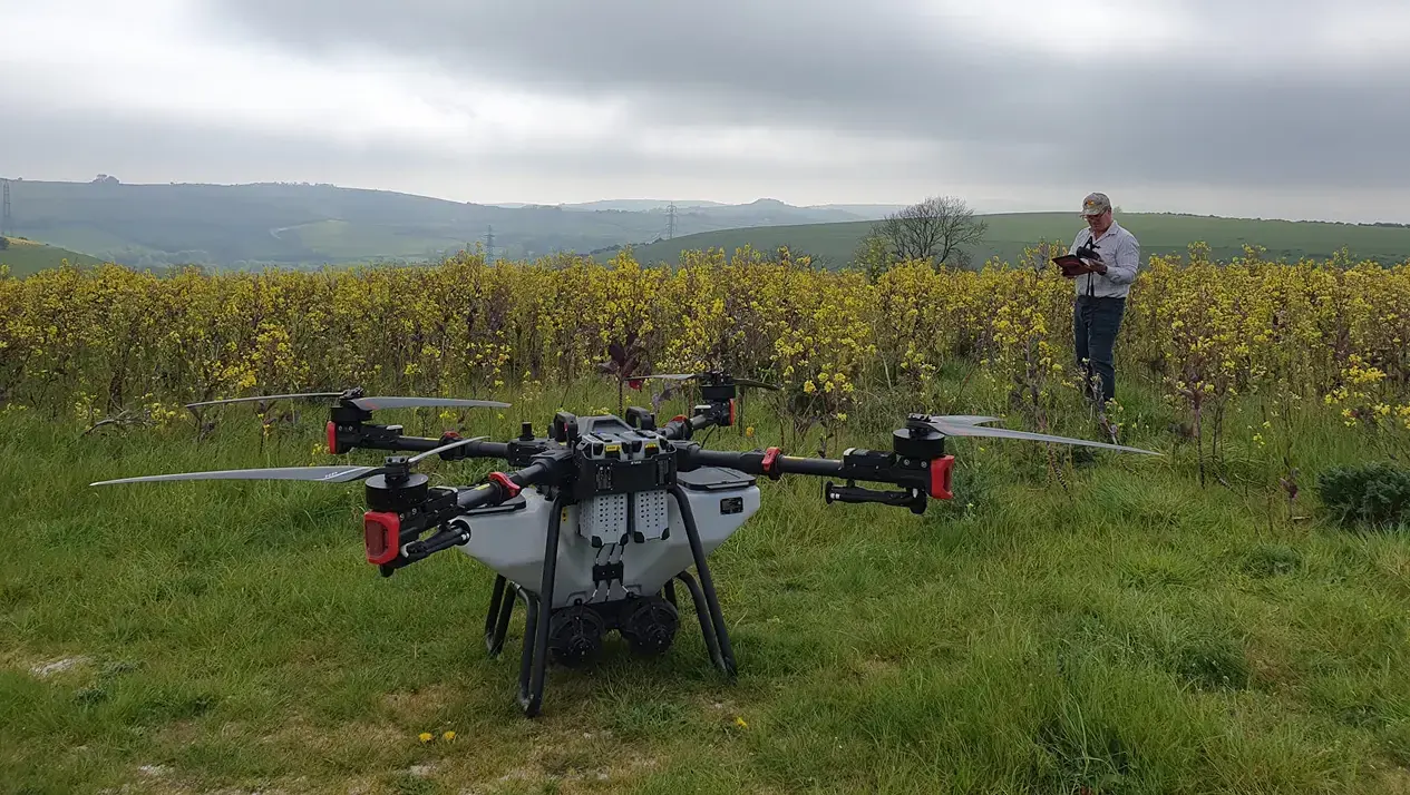 Ben prepares the drone for seeding a multi-species cover crop into a standing winter crop