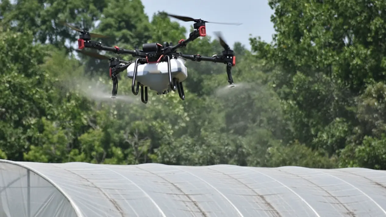 Drone cleaning a poly tunnel