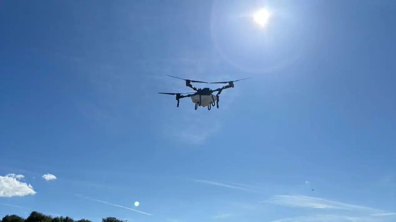 XAG P100 flies under hot sun.