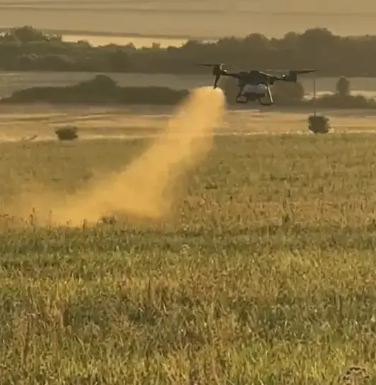 XAG p100 Drone spraying a field of maze